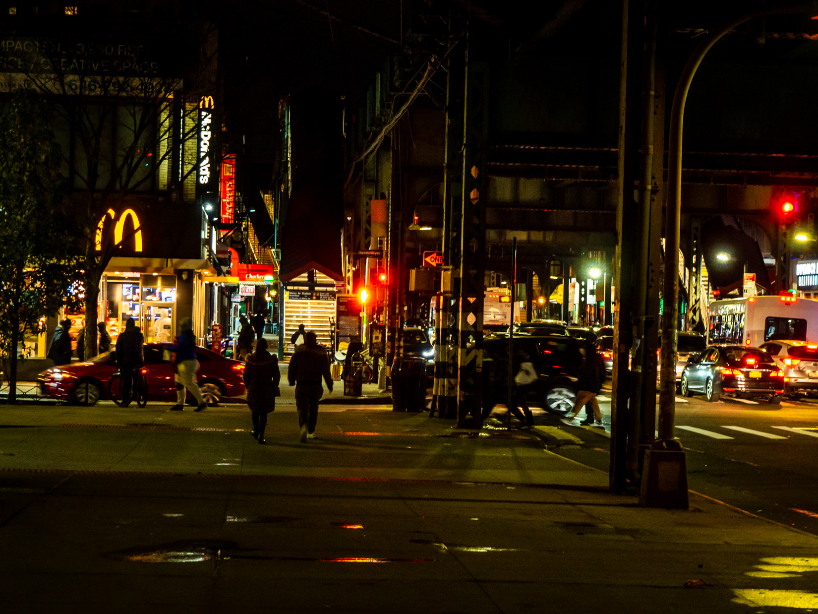 People Walking in Brooklyn at Night